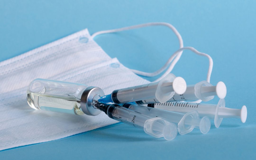 Conceptual drug-shortage photo showing several syringes poking into a single vial.